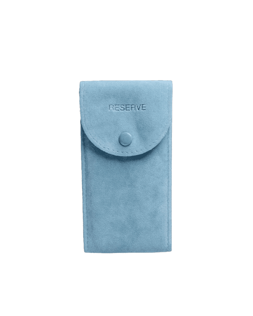 The JBW RESERVE Aqua Pouch is a light blue suede pouch featuring a flap closure with button and embossed RESERVE on the front.