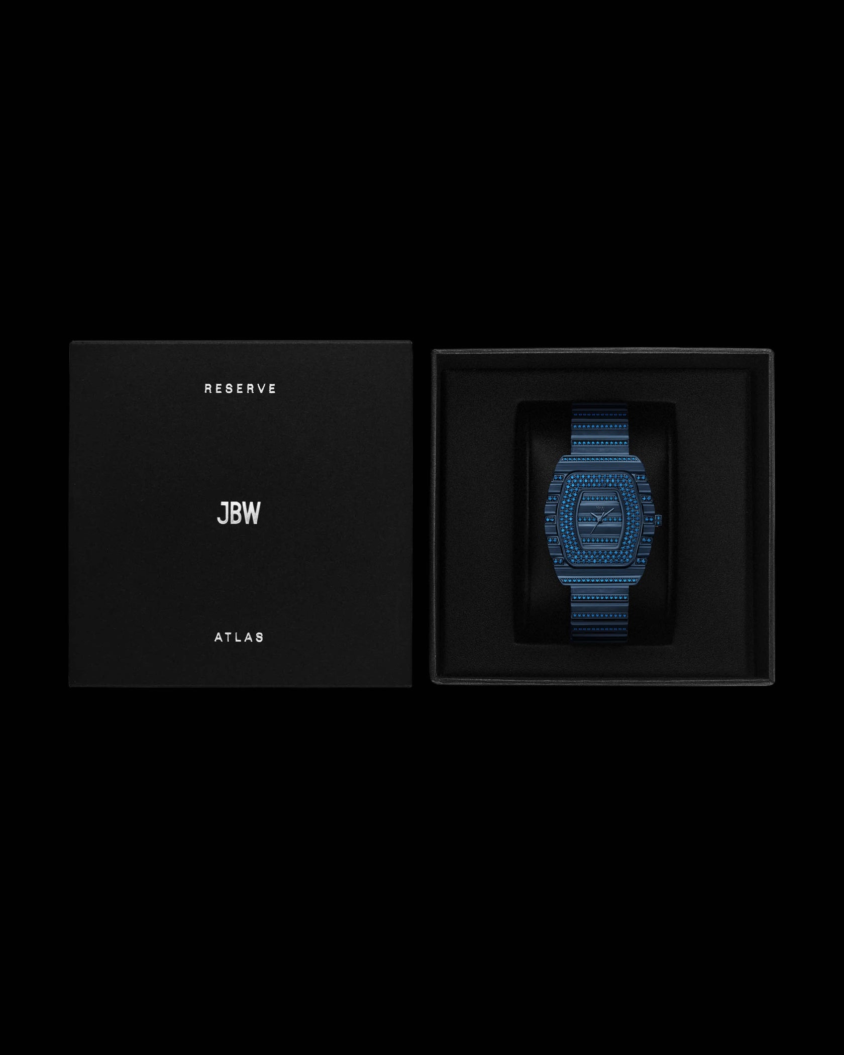 A limited edition RESERVE Atlas Bleu | R6404A by JBW Watches with a matching blue band is displayed in an open black box. The removed lid beside it reads RESERVE JBW ATLAS in white on black.