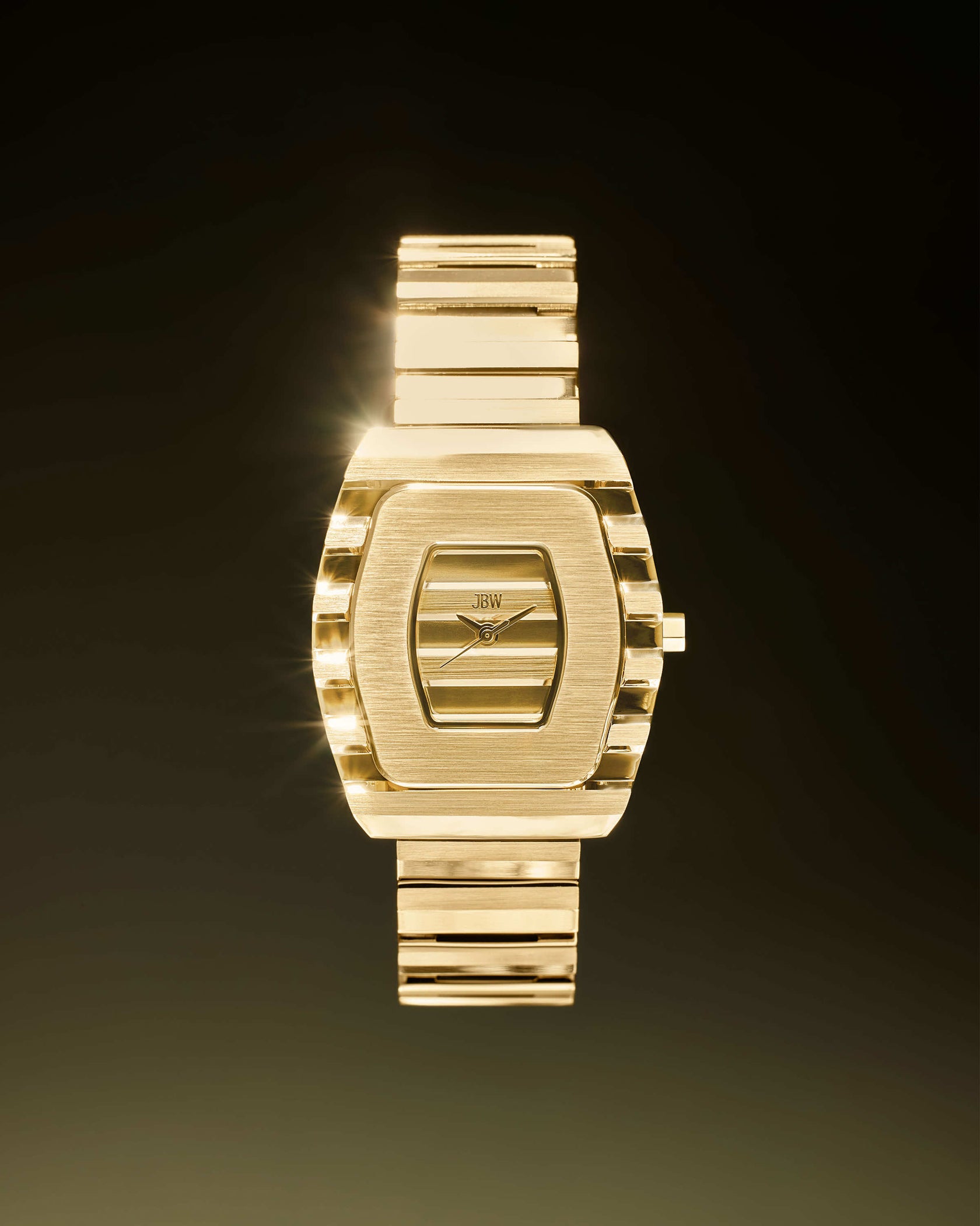 The JBW Watches Atlas | J6403A is an 18K gold-plated women’s luxury watch with a rectangular face, gold band, and JBW logo on the dial, shown on a dark gradient background with a bright gleam on the left.