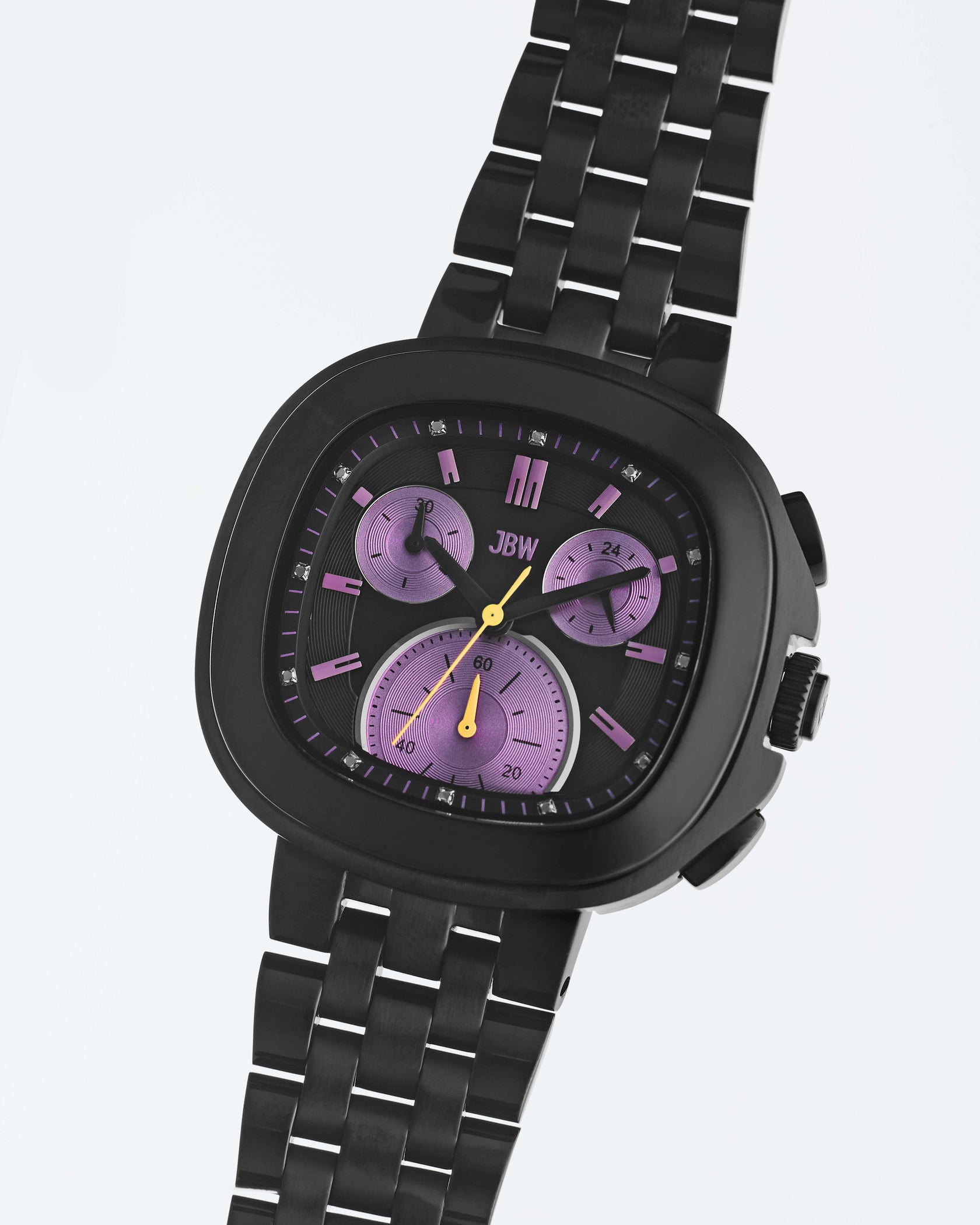 The JBW Watches Coast | J6397E is a black stainless steel watch with a rectangular face, three purple subdials, yellow hands, and the JBW logo on the dial, displayed against a light background.