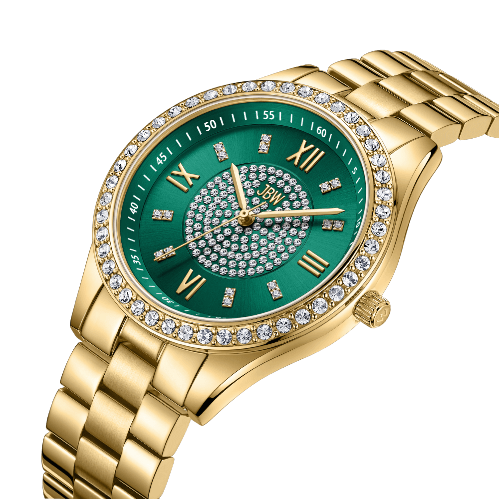 The JBW Mondrian | J6303E is a gold-plated stainless steel watch with a green dial, Roman numerals, clear gemstone bezel, diamond hour markers, and a gold metal link band for added elegance.