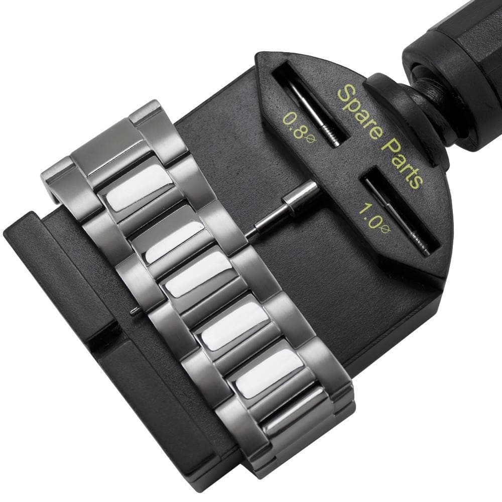 A close-up of the JBW WATCH SIZING TOOL, a heavy-duty link remover with twist action, adjusts a metal watch strap. Labeled slots display Spare Parts and precise size measurements of 0.8 and 1.0 for accurate adjustments.