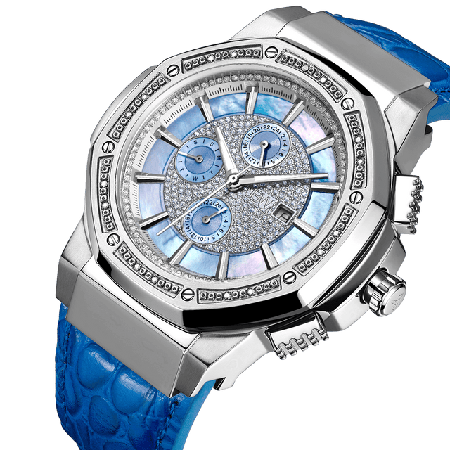 The JBW Saxon 10 YR | JB-6101L-10B is a luxury diamond watch with a silver case, blue crocodile-pattern leather strap, detailed silver and blue dial with three subdials, diamond accents, and date display.