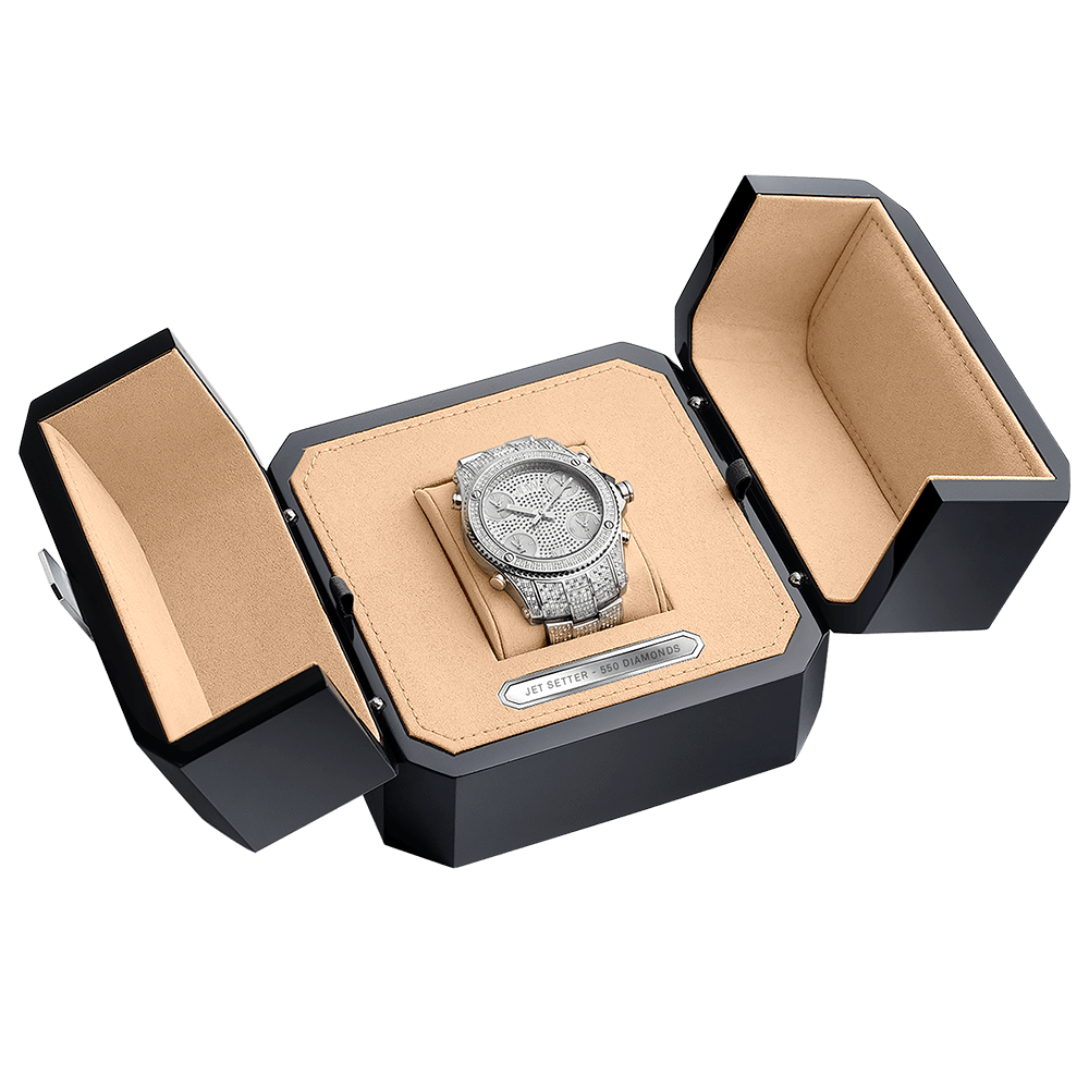 The Jet Setter PS (Sample Sale) | PS550B-GB by JBW Watches, a Swiss watch adorned with diamonds, is presented on a tan cushion inside an open black and tan box with outward-folded side panels.