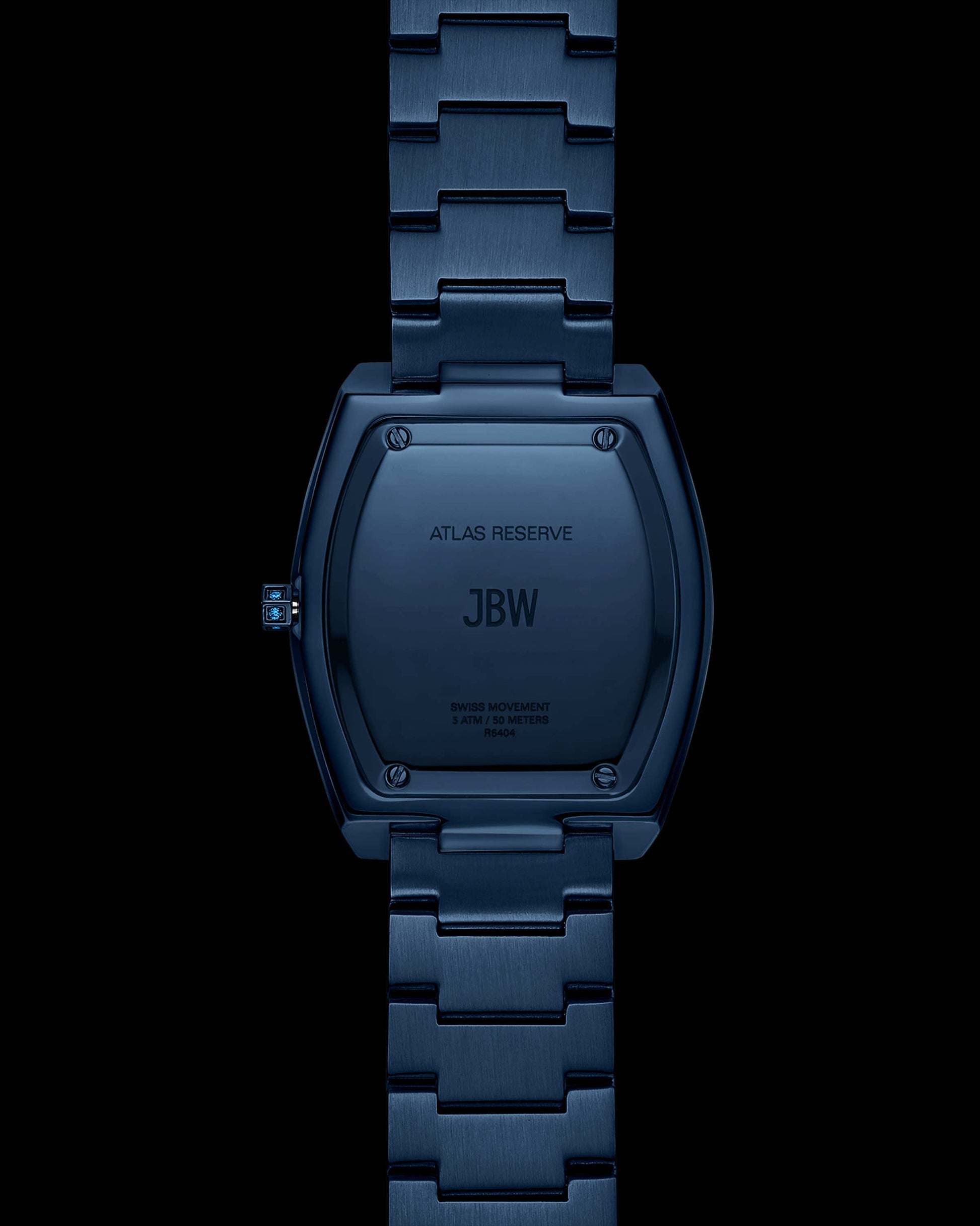 A close-up of the back of the RESERVE Atlas Bleu | R6404A by JBW Watches shows “ATLAS RESERVE,” “JBW,” and “SWISS MOVEMENT STAINLESS STEEL WATER RESISTANT” engraved, highlighting this limited edition blue crystal watch and its metal band.