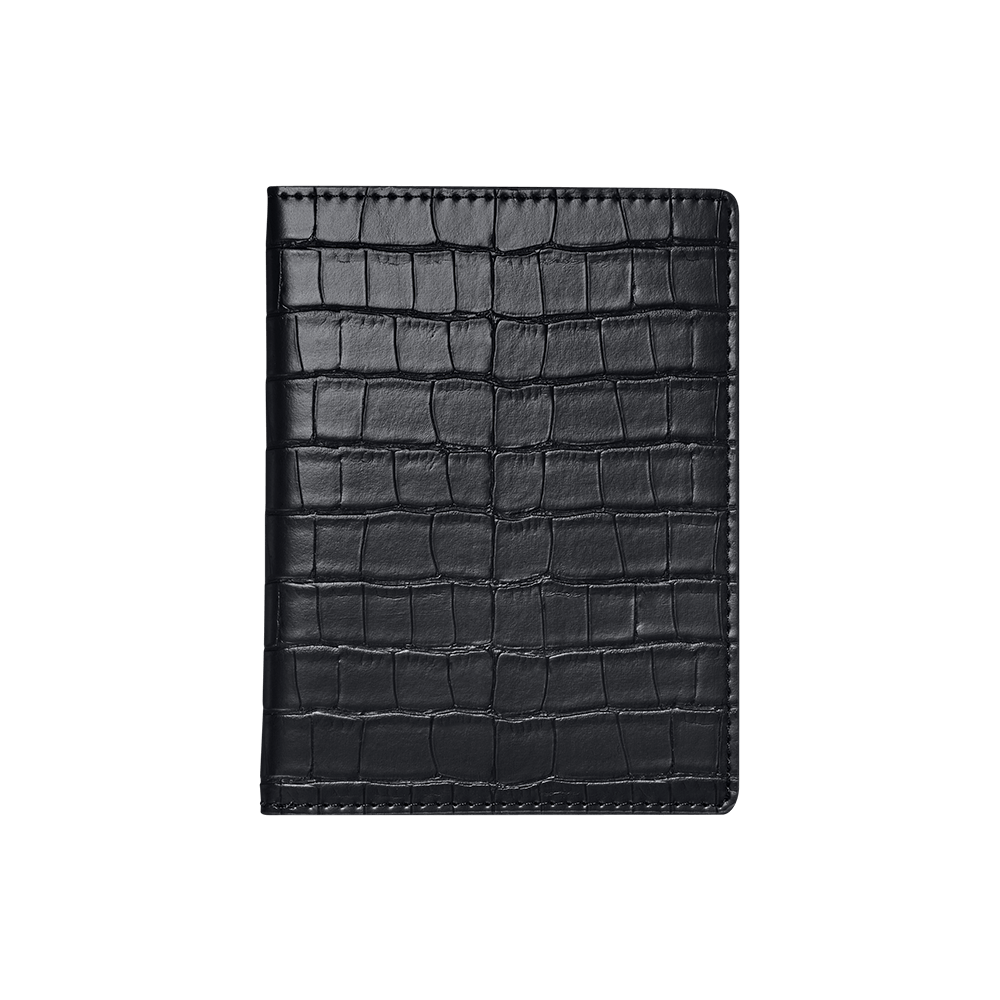 The JBW Watches Passport Holder | J1030, made of black genuine leather with a crocodile skin texture, is shown closed from above on a light gray background—perfect for keeping your passport protected.