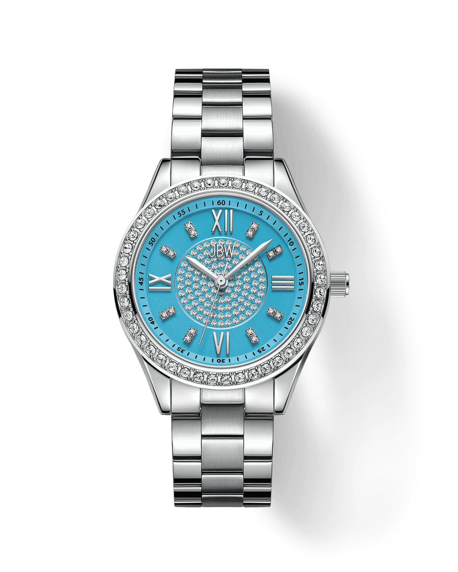 The Mondrian 34 | J6388E by JBW Watches features a jeweled bezel, bright blue face with Roman numerals and crystal hour markers, metal link band, and decorative crystals on the dial center. Swiss movement adds elegance to this silver wristwatch.