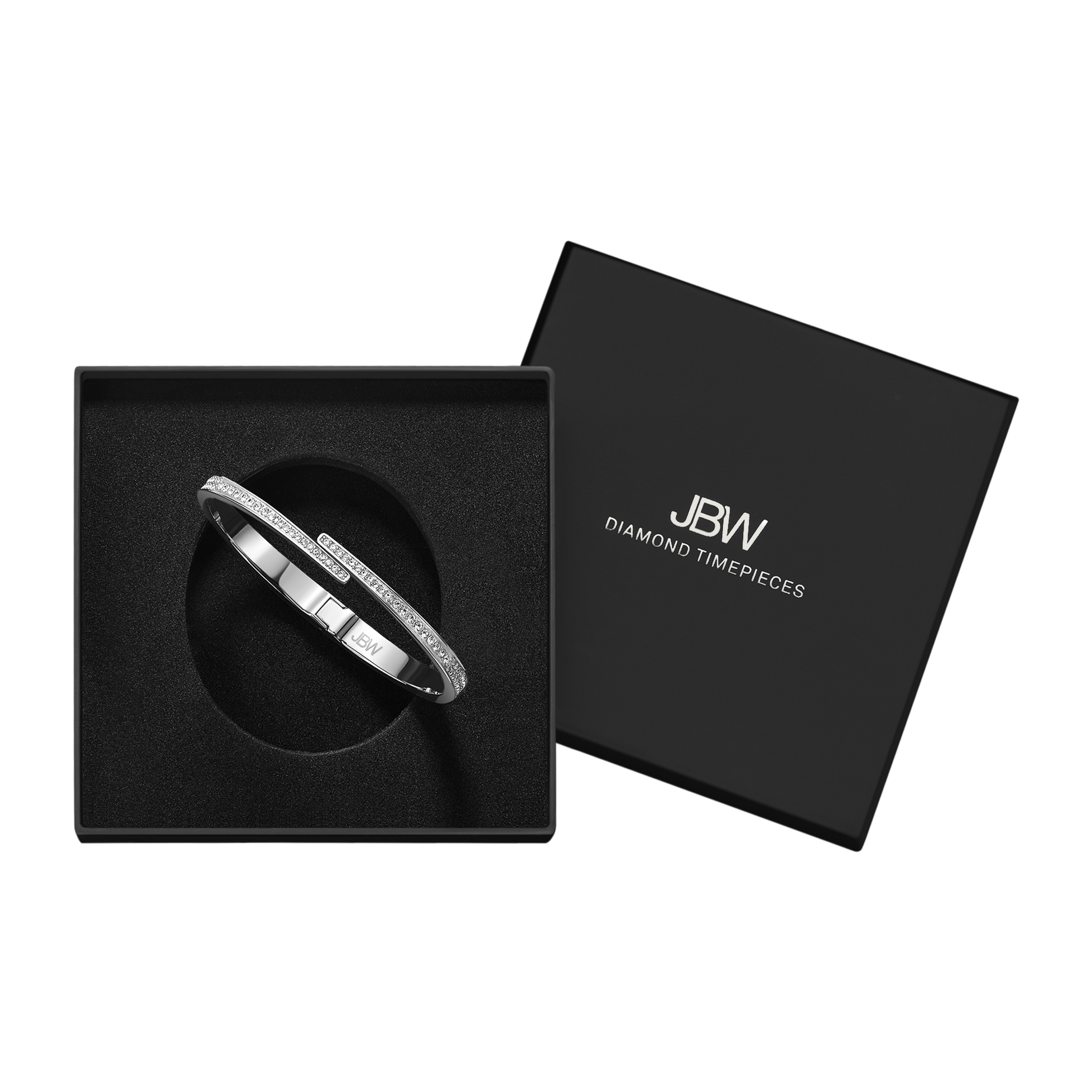 The Crystal Pave Bangle - Silver | J1023A by JBW sparkles with crystals as it rests in a sleek black box, the lid set aside to reveal the iconic JBW logo.