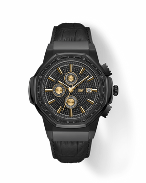 The JBW Watches Saxon | JB-6101L-S is a black luxury timepiece featuring a textured black dial, gold hands and markers, three sub-dials, a date window, and a sleek black leather strap.
