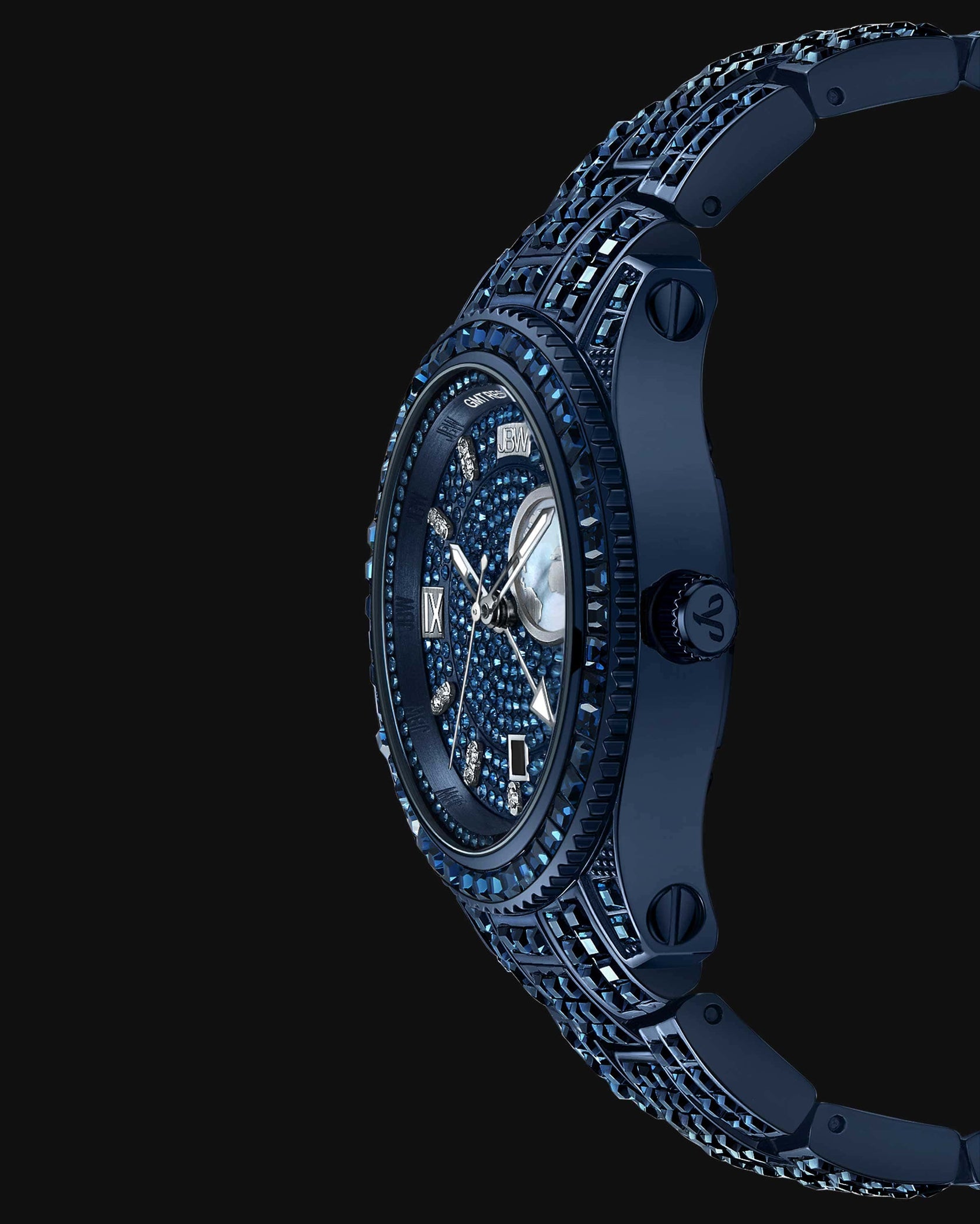 The RESERVE Bleu 39 | R6393A-GA Sample Sale (Grade A) by JBW Watches is shown from the side against a black background, highlighting its sapphire blue crystals, gemstone-encrusted face and band, and Swiss GMT movement.