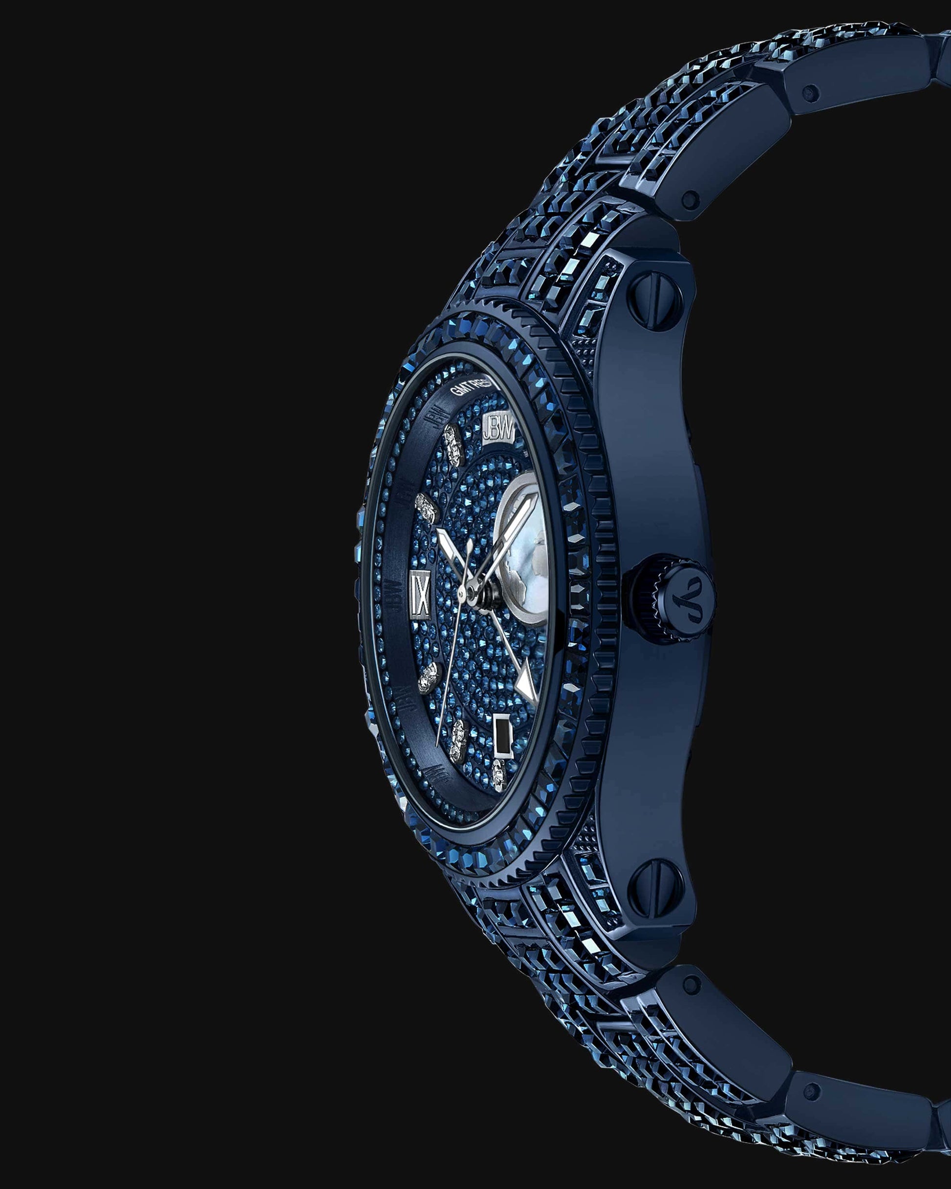 The RESERVE Bleu 39 | R6393A-GA Sample Sale (Grade A) by JBW Watches is shown from the side against a black background, highlighting its sapphire blue crystals, gemstone-encrusted face and band, and Swiss GMT movement.