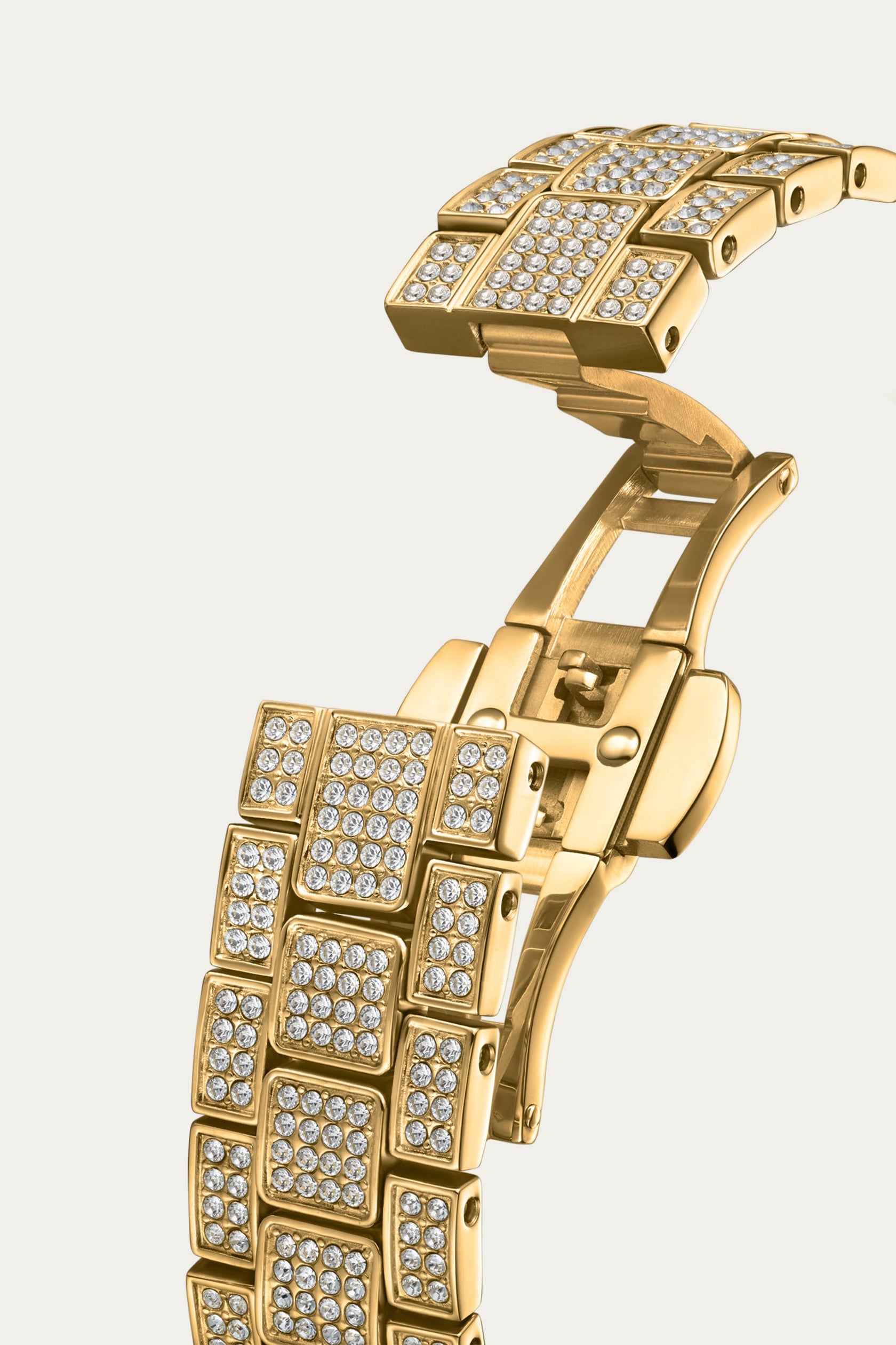 Close-up of the JBW Watches Arc Single (Sample Sale) | J6390A-GA Grade A bracelet—gold rectangular links, each adorned with sparkling white crystals, and a clasp, shown against a plain light background.